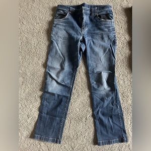 Eddie Bauer slim tapered stretchy blue jeans.